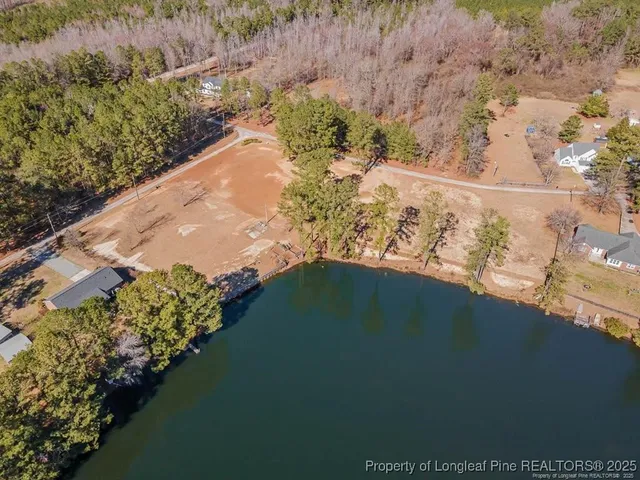 a view of a lake with a yard