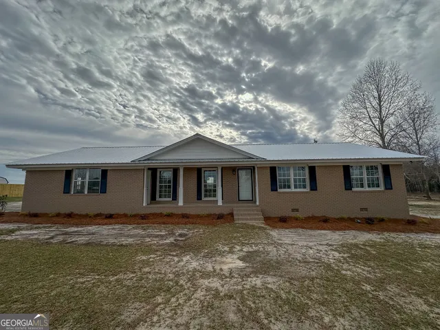 a house with trees in front of it