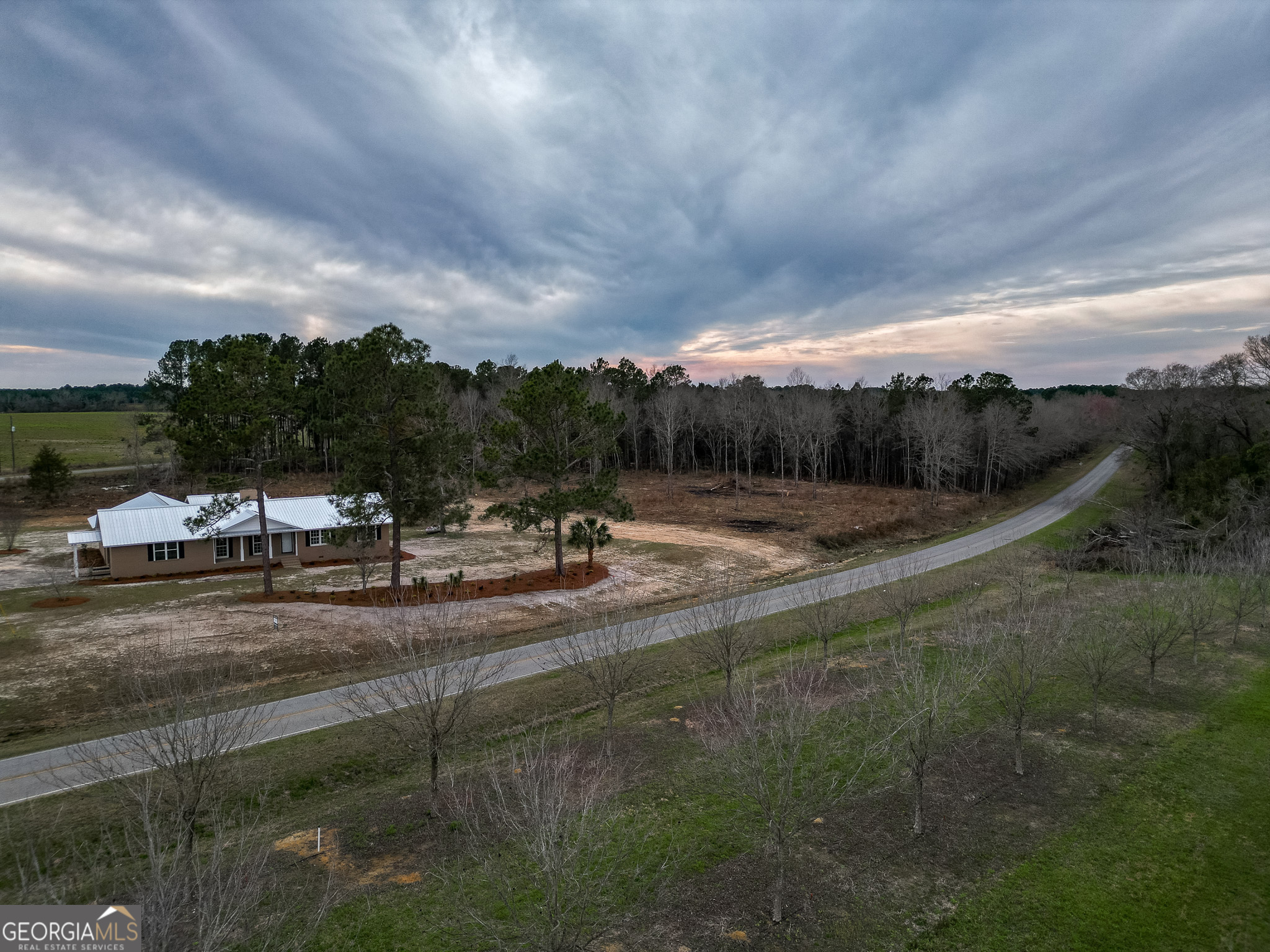 895 Cannonville Road Abbeville, GA 31001 - Photo 17 of 20 a view of a dry yard with wooden fence