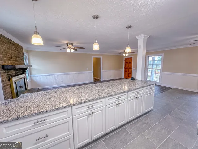 a kitchen with a sink and a refrigerator