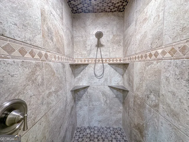 a close view of a shower in bathroom