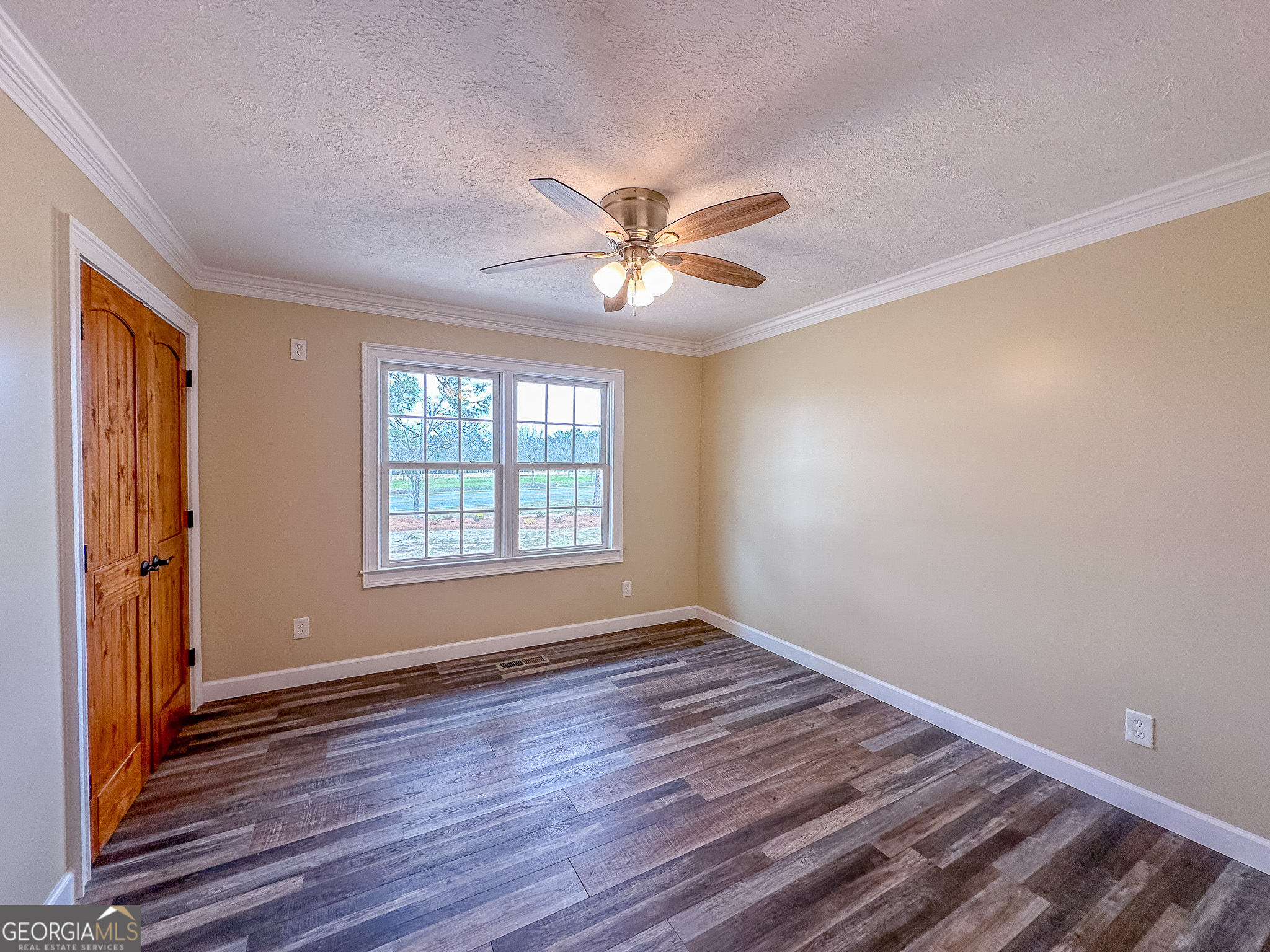 895 Cannonville Road Abbeville, GA 31001 - Photo 10 of 20 wooden floor in an empty room with a window