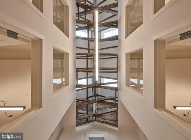 a view of a brick house with large windows