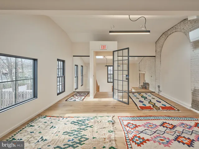 a bedroom with a bed and a rug