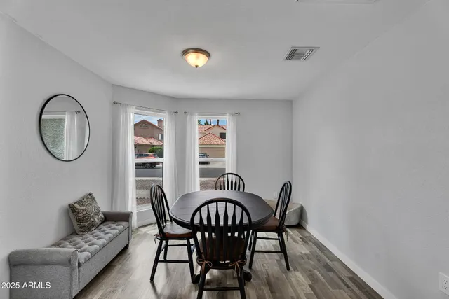 a view of a dining room with furniture and a table