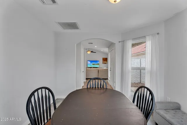 a view of a hallway with wooden floor and a floor to ceiling window