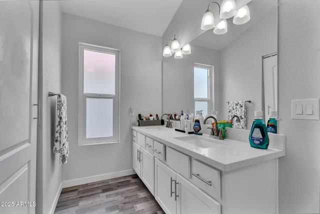 a bathroom with sink and mirror