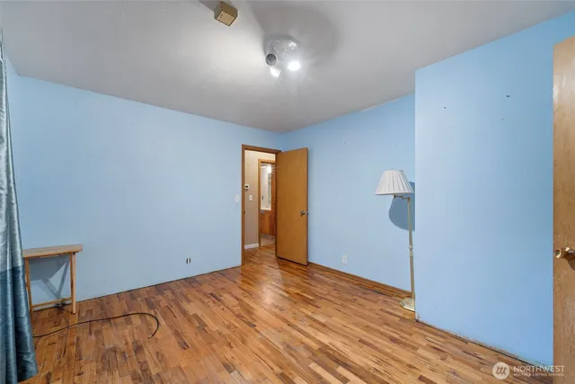 a bedroom with bed and window