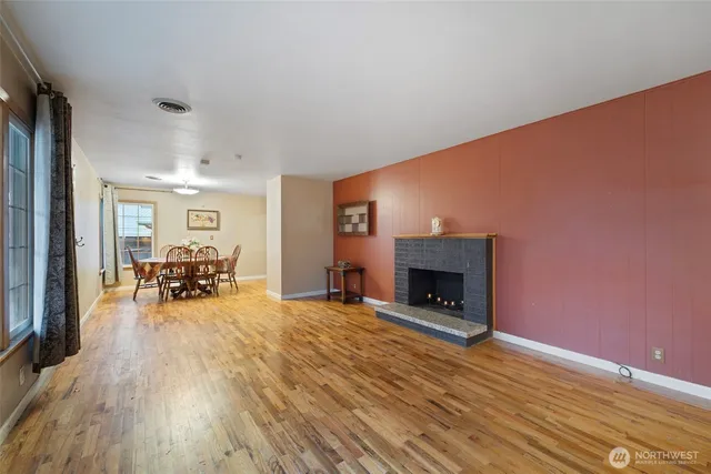 a view of living room with furniture and fireplace