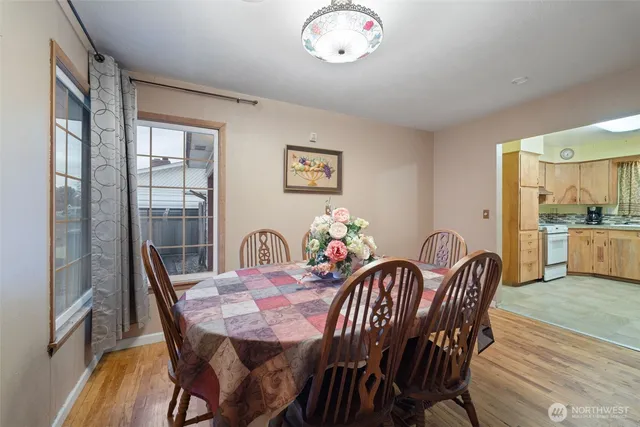 a view of a dining room with furniture window and wooden floor