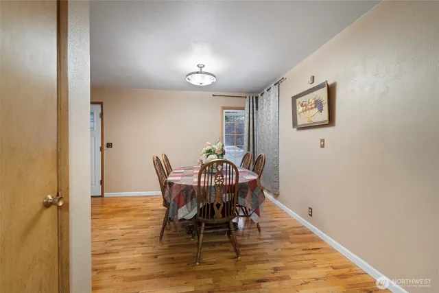 a kitchen with refrigerator and table