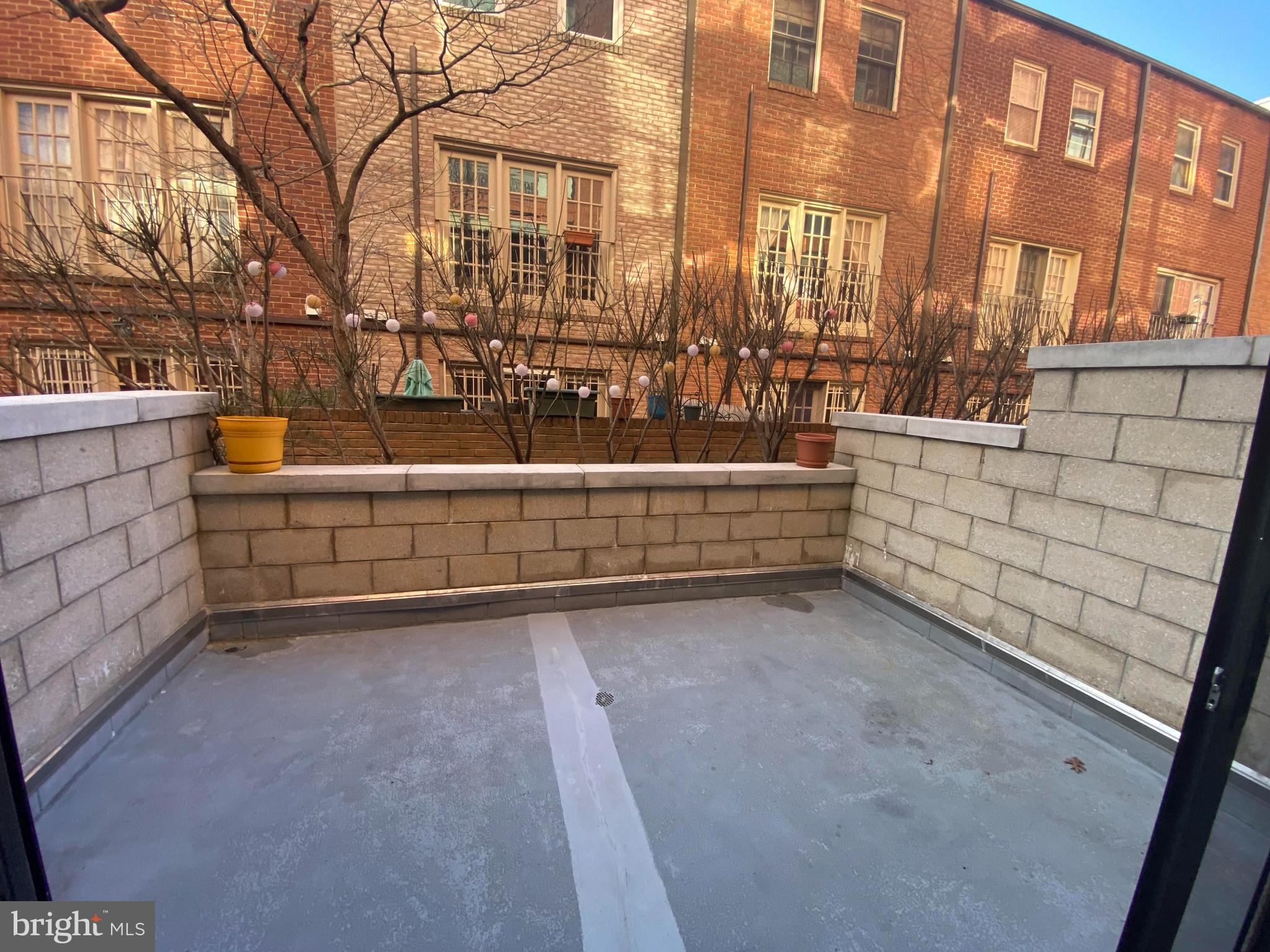 1654 Euclid Street Northwest, Unit 105 Washington, DC 20009 - Photo 15 of 29 a view of a terrace with outdoor seating
