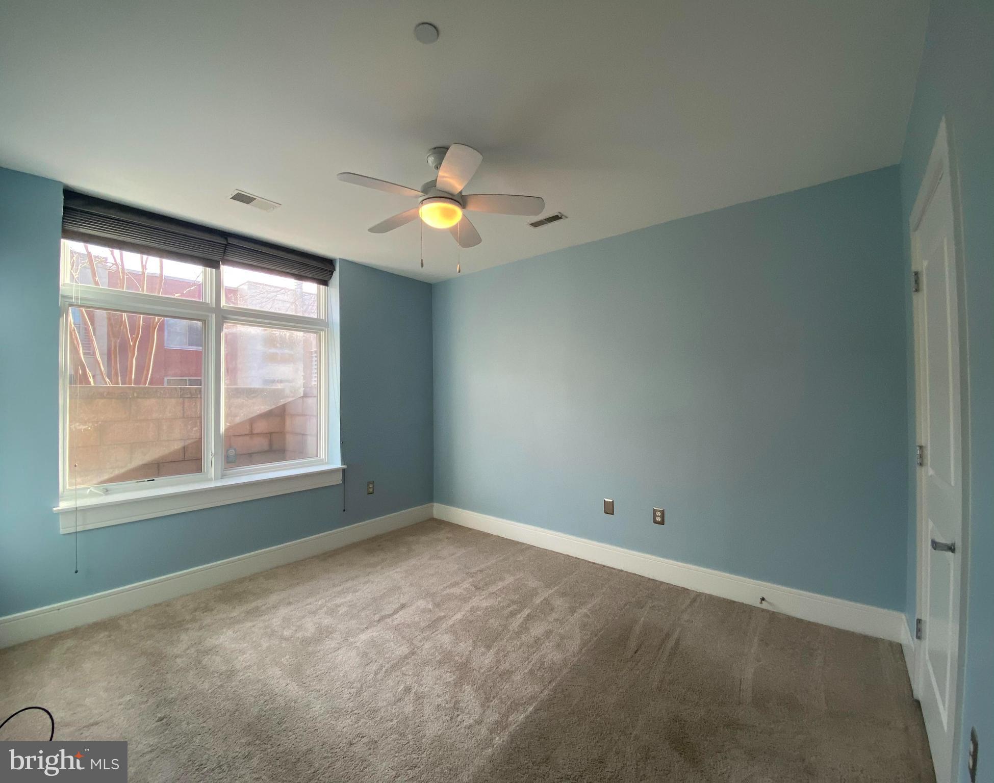 1654 Euclid Street Northwest, Unit 105 Washington, DC 20009 - Photo 16 of 29 an empty room with a window
