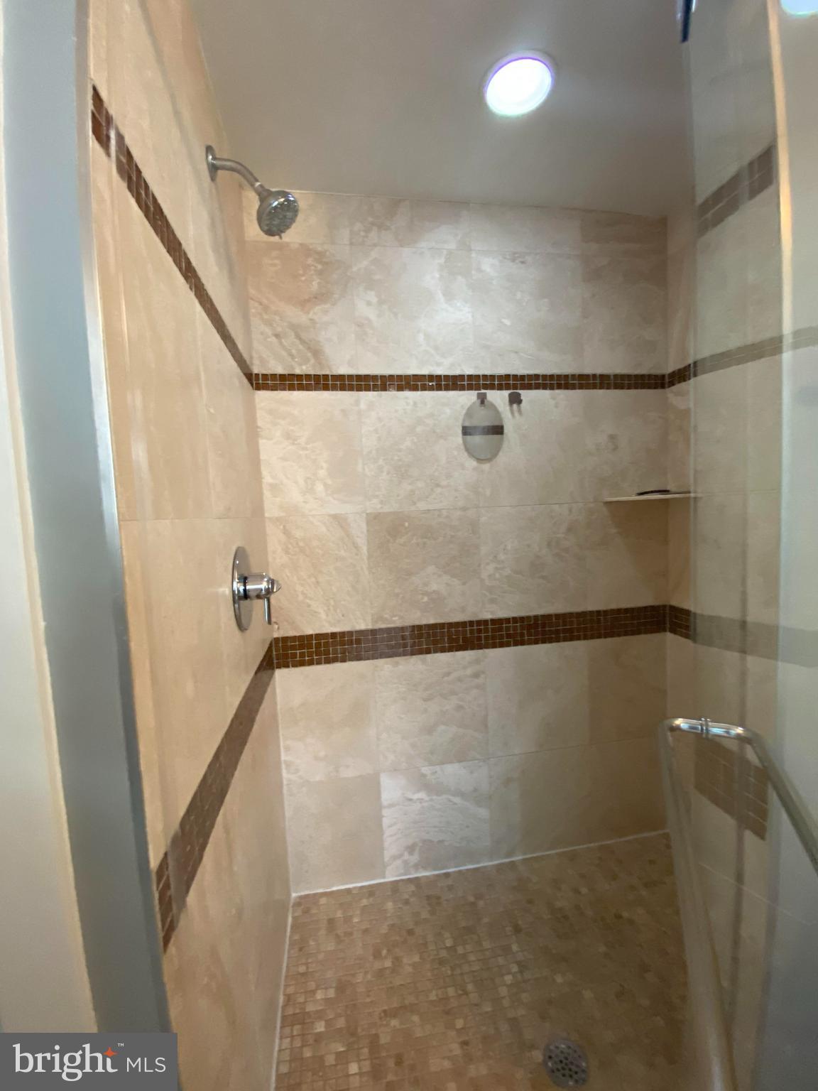 1654 Euclid Street Northwest, Unit 105 Washington, DC 20009 - Photo 21 of 29 a bathroom with a shower