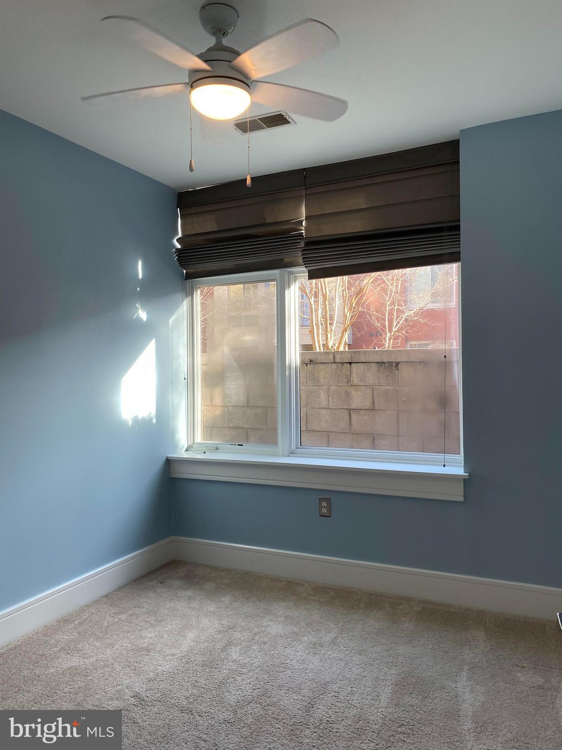 1654 Euclid Street Northwest, Unit 105 Washington, DC 20009 - Photo 22 of 29 an empty room with a window