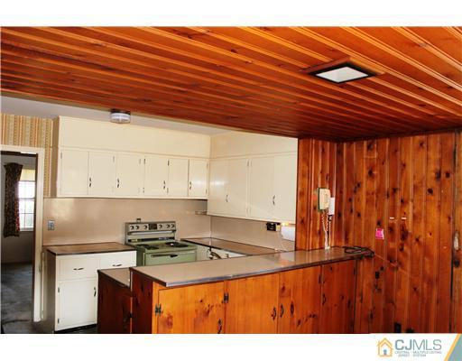 75 Stafford Road Colonia, NJ 07067 - Photo 5 of 10 a kitchen that has a lot of cabinets in it
