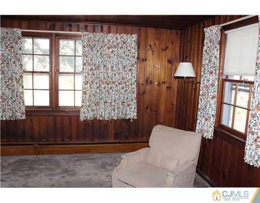 75 Stafford Road Colonia, NJ 07067 - Photo 6 of 10 a living room with a couch and large window