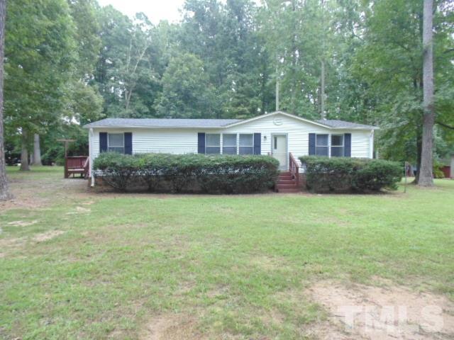 4522 Thomas Road Henderson, NC 27537 - Photo 1 of 19 front view of a house with a yard