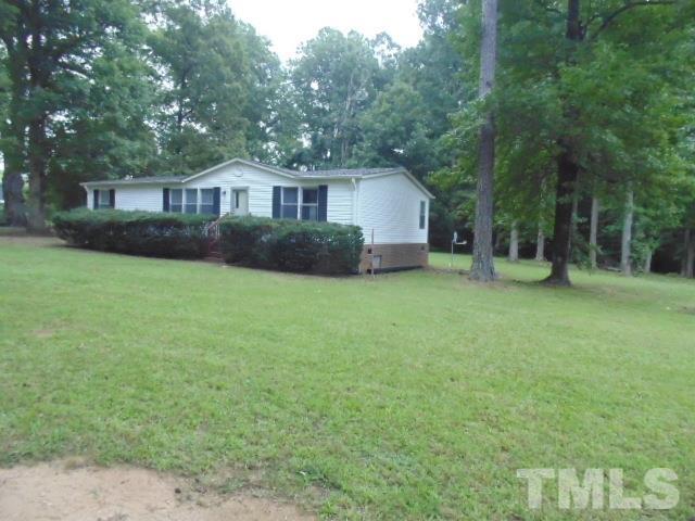 4522 Thomas Road Henderson, NC 27537 - Photo 2 of 19 a view of a house with a yard and sitting area