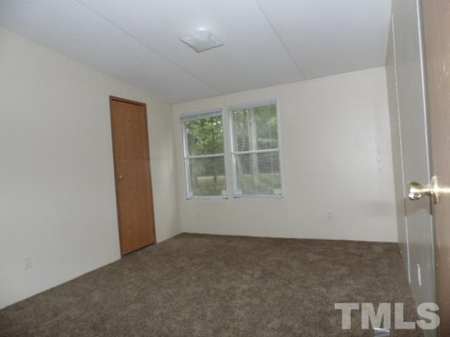 4522 Thomas Road Henderson, NC 27537 - Photo 17 of 19 an empty room with windows