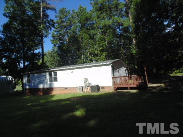 4522 Thomas Road Henderson, NC 27537 - Photo 4 of 19 a view of a house with a yard