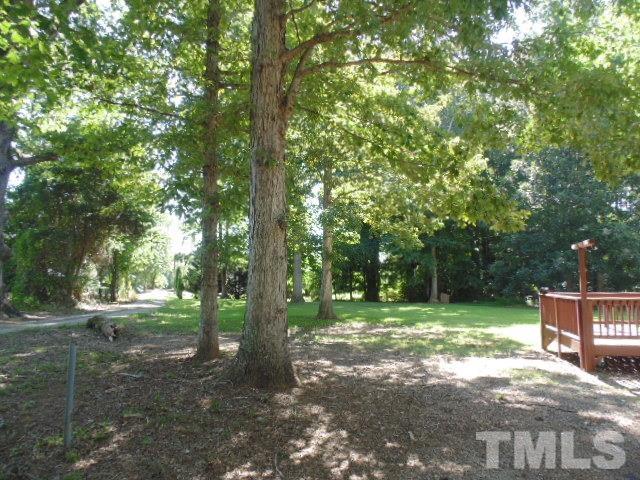 4522 Thomas Road Henderson, NC 27537 - Photo 6 of 19 a view of a trees with a yard