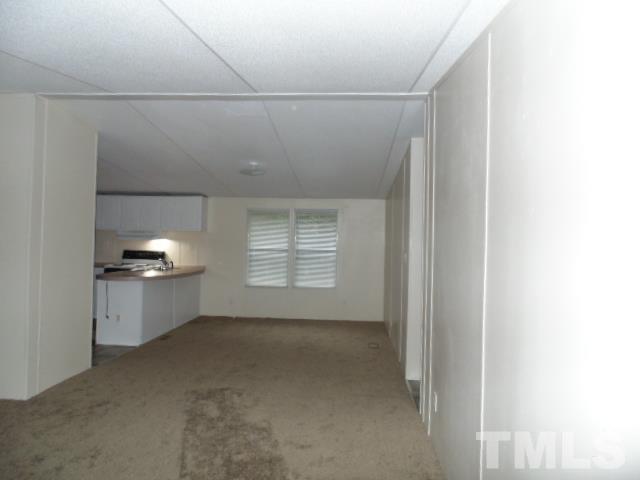 4522 Thomas Road Henderson, NC 27537 - Photo 10 of 19 a view of a room with a fireplace