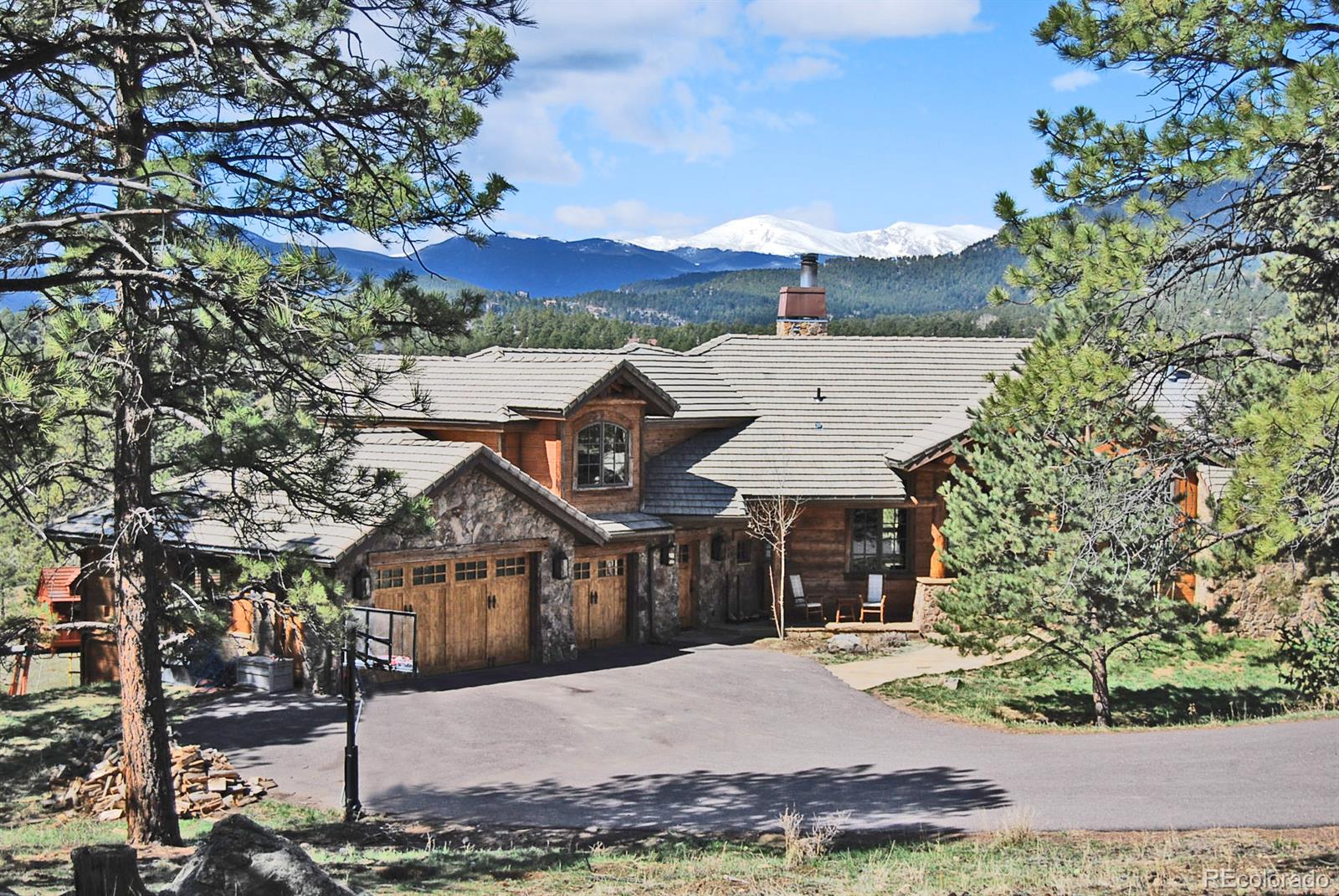 2127 Wieler Road Evergreen, CO 80439 - Photo 1 of 35 a view of a town with barn house