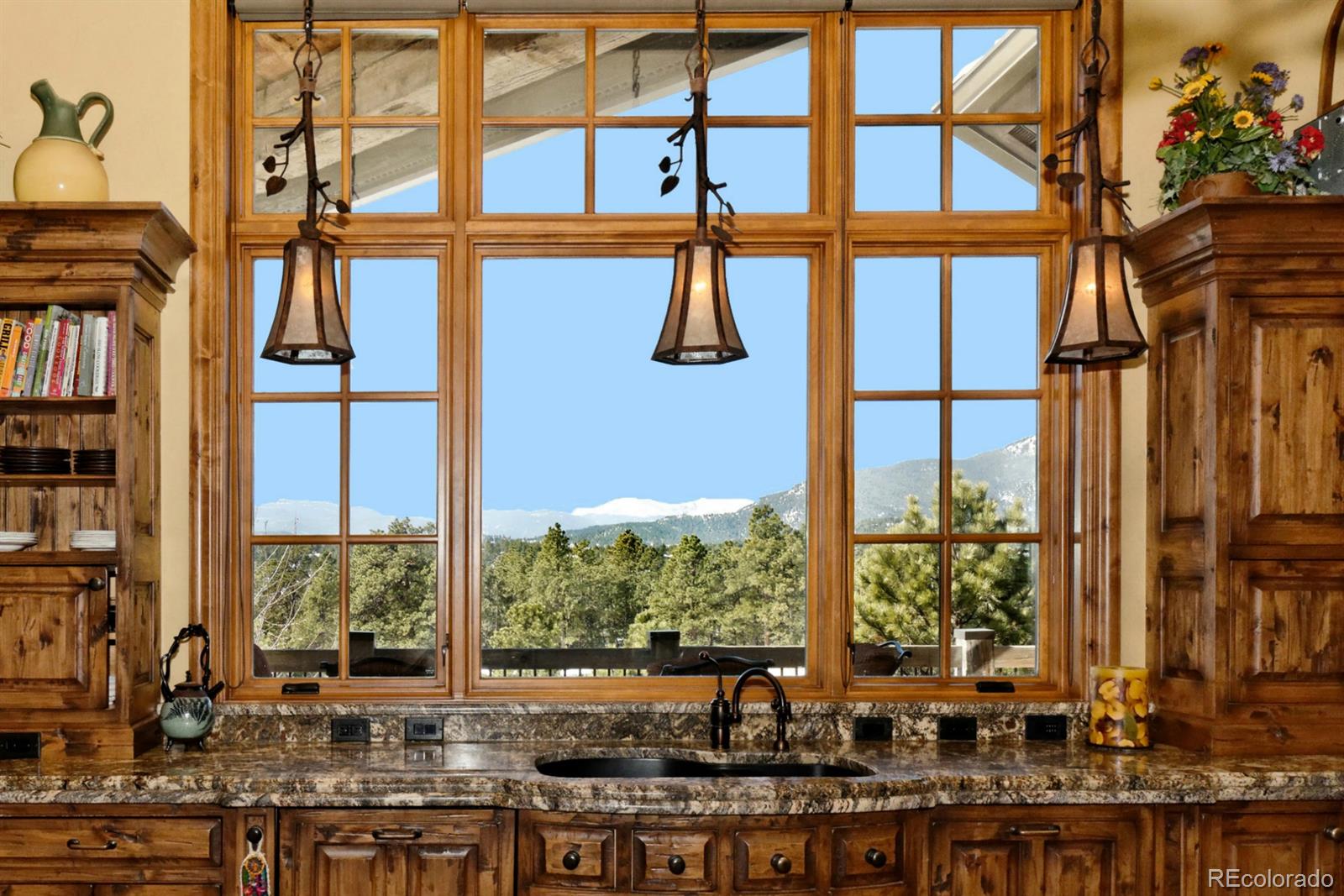 2127 Wieler Road Evergreen, CO 80439 - Photo 11 of 35 a view of a building from a window