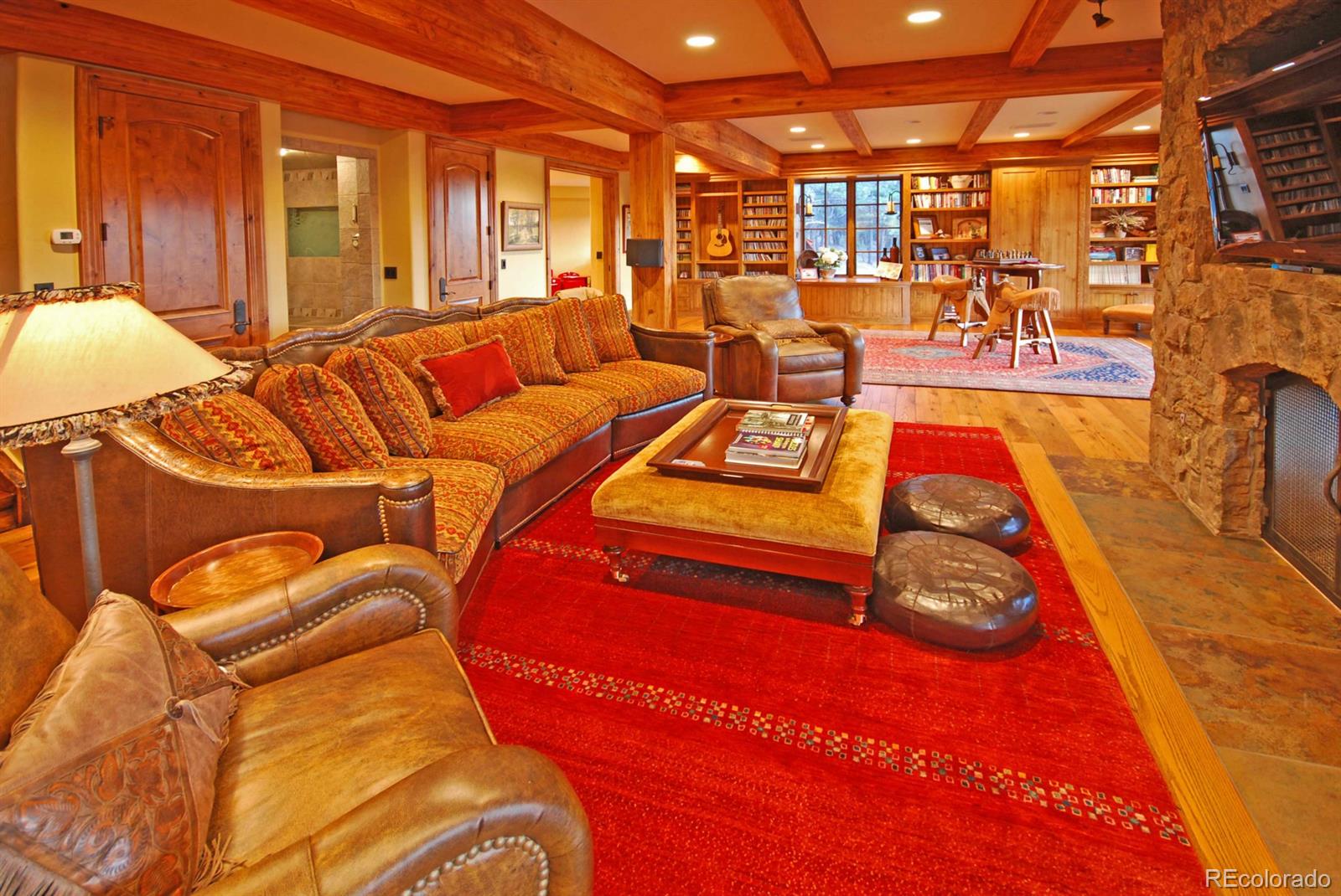 2127 Wieler Road Evergreen, CO 80439 - Photo 23 of 35 a living room with blue lights with furniture