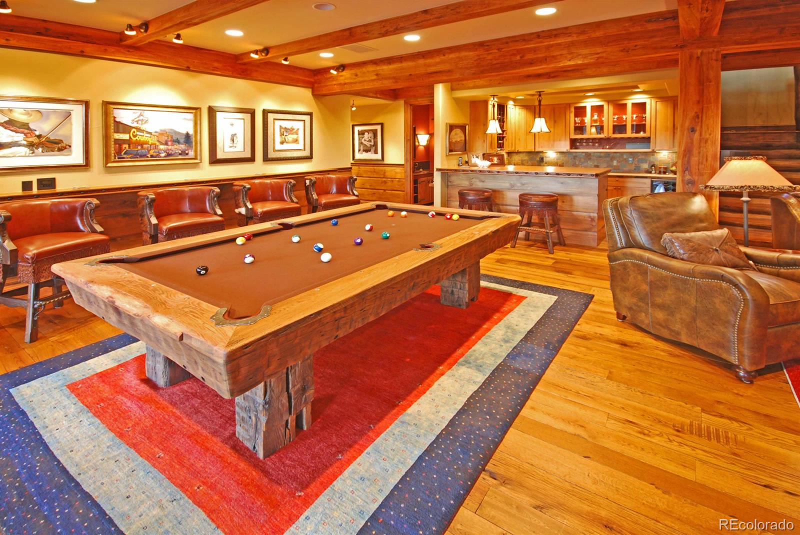 2127 Wieler Road Evergreen, CO 80439 - Photo 24 of 35 a living room with furniture pool table and large windows