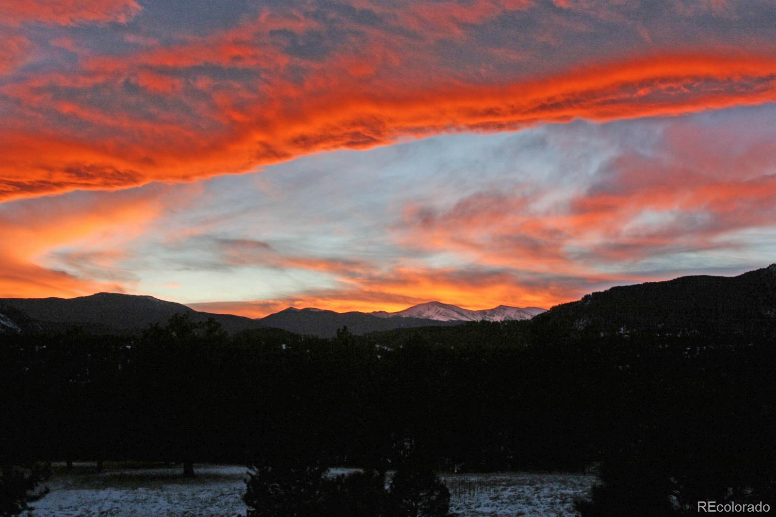 2127 Wieler Road Evergreen, CO 80439 - Photo 4 of 35 a view of a city with sunset