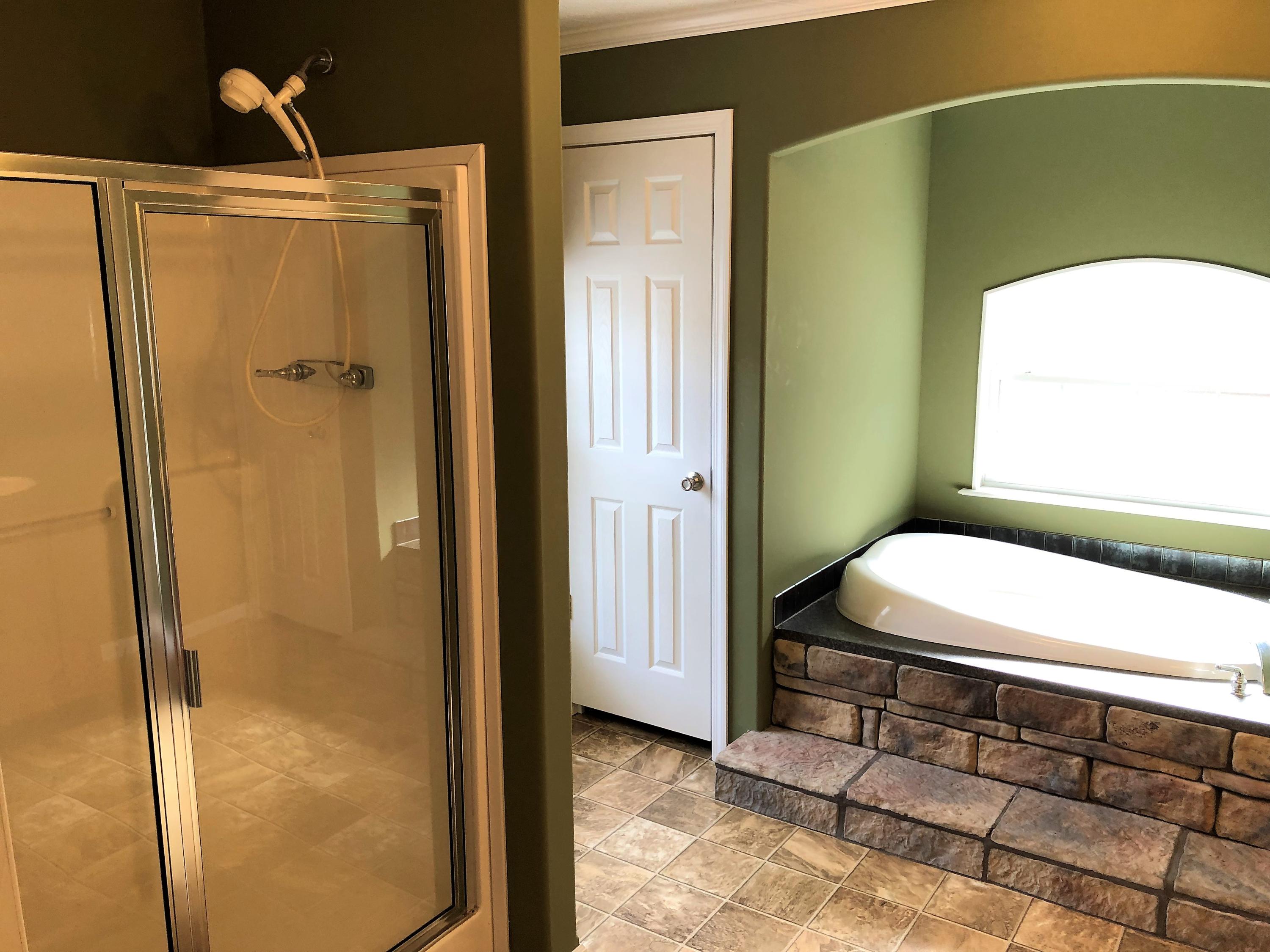 168 Lucas Road DeFuniak Springs, FL 32433 - Photo 8 of 25 a bathroom with a sink and a mirror