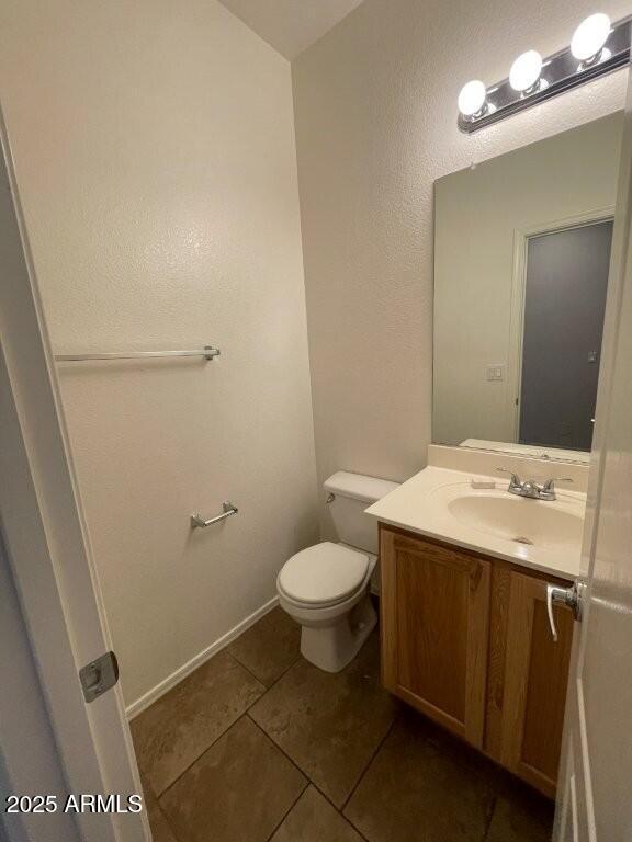 2150 West Alameda Road, Unit 1054 Phoenix, AZ 85085 - Photo 12 of 17 a bathroom with a sink a toilet a mirror and vanity