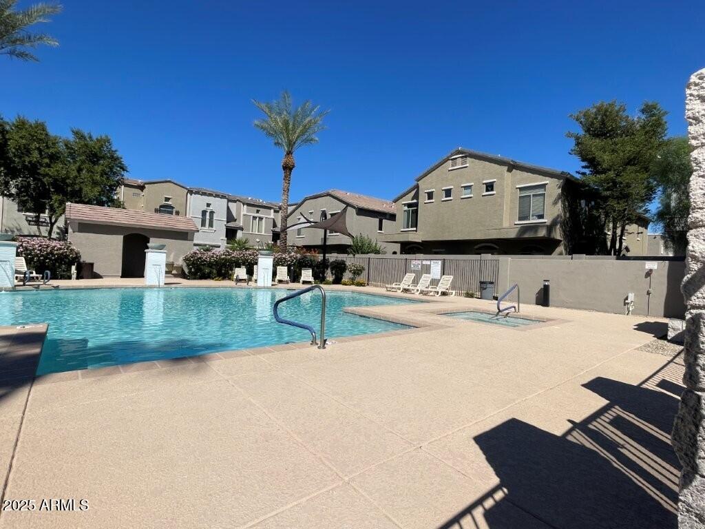 2150 West Alameda Road, Unit 1054 Phoenix, AZ 85085 - Photo 16 of 17 a view of a house with backyard and sitting area