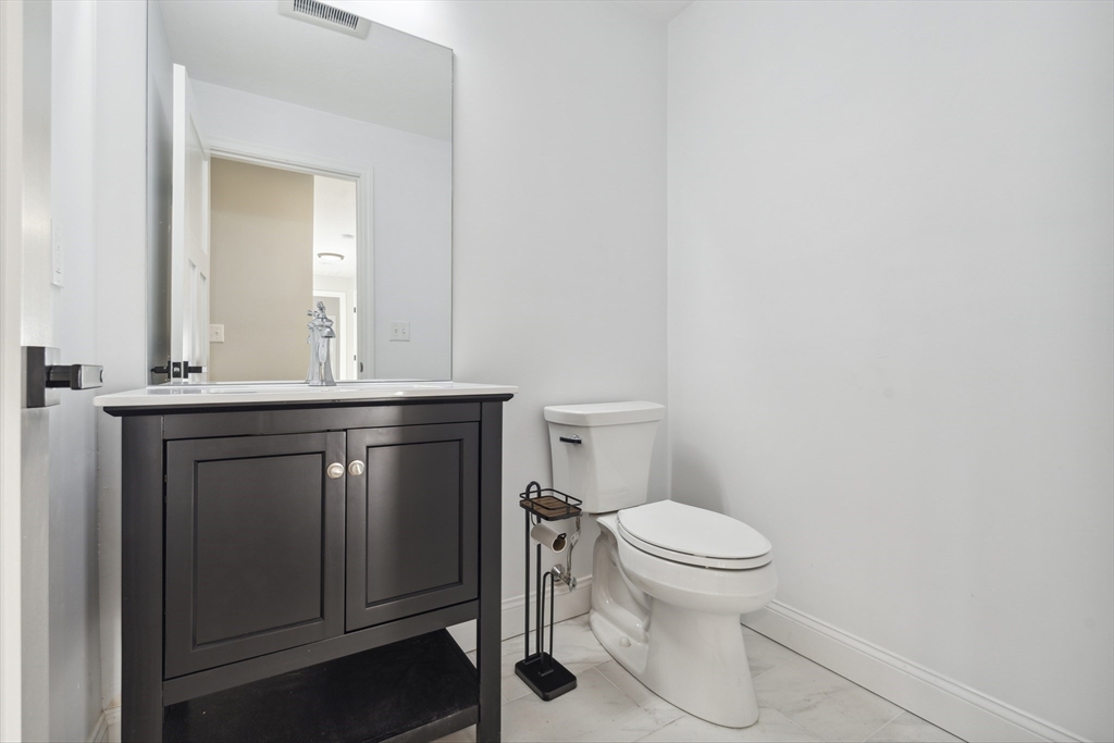 6 Coppersmith Way Townsend, MA 01469 - Photo 16 of 33 a bathroom with a toilet a sink and mirror