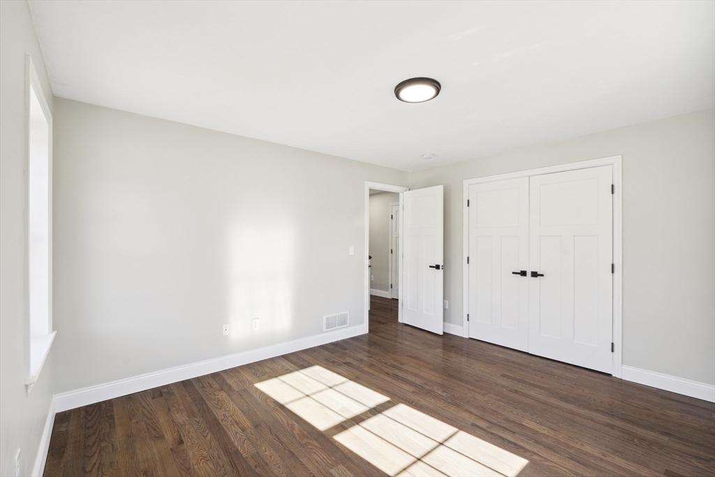 6 Coppersmith Way Townsend, MA 01469 - Photo 18 of 33 a view of an empty room and wooden floor