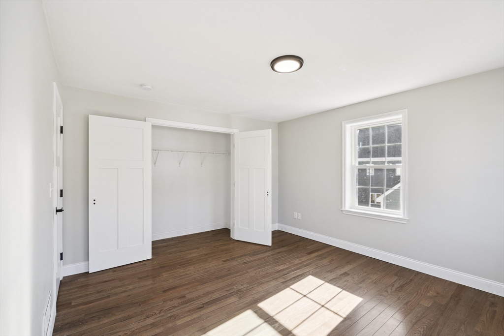 6 Coppersmith Way Townsend, MA 01469 - Photo 19 of 33 an empty room with wooden floor and windows