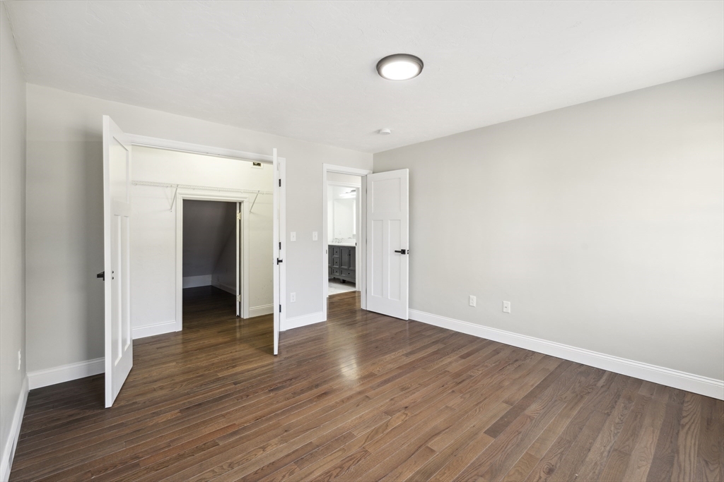 6 Coppersmith Way Townsend, MA 01469 - Photo 20 of 33 a view of an empty room with wooden floor and closet