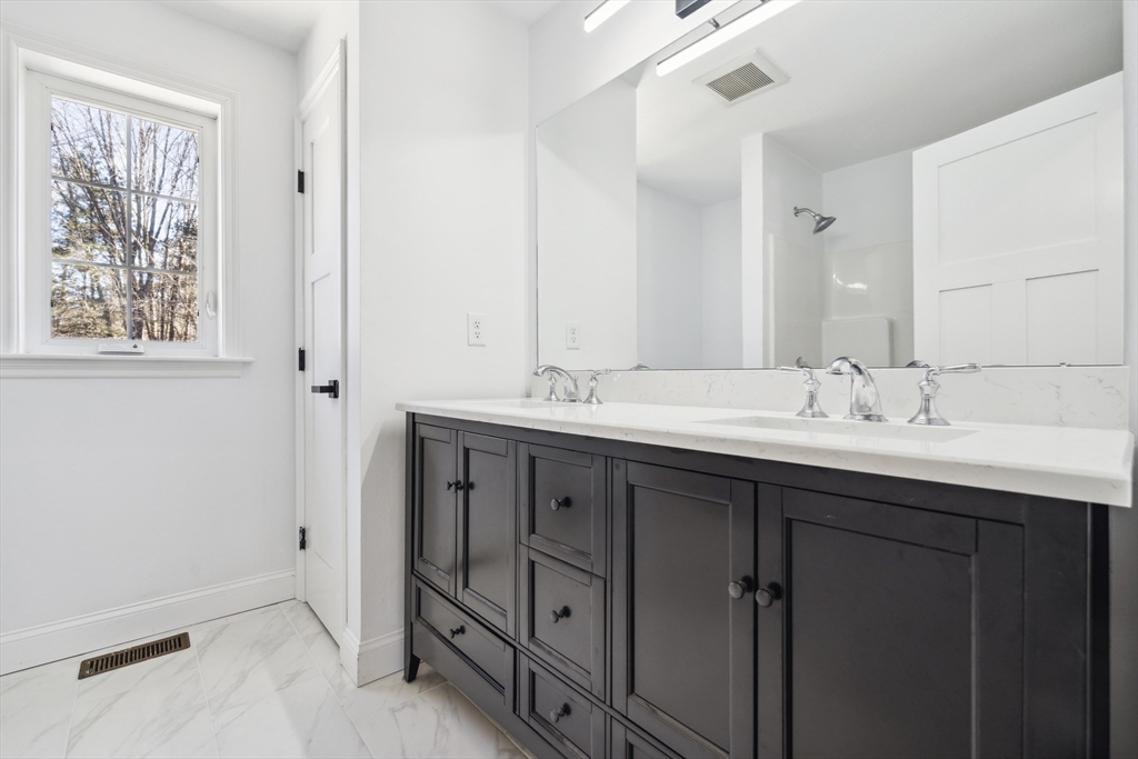 6 Coppersmith Way Townsend, MA 01469 - Photo 22 of 33 a bathroom with double sink and a mirror