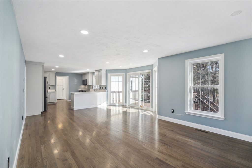 6 Coppersmith Way Townsend, MA 01469 - Photo 4 of 33 a view of an empty room with wooden floor and a window