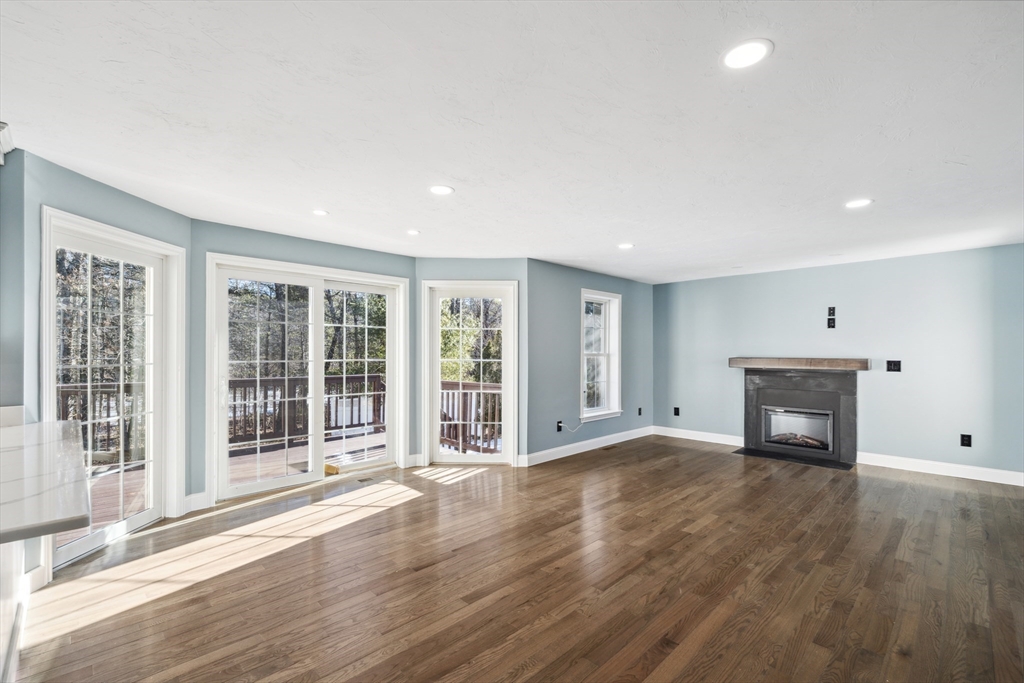 6 Coppersmith Way Townsend, MA 01469 - Photo 5 of 33 a view of an empty room with wooden floor and a window