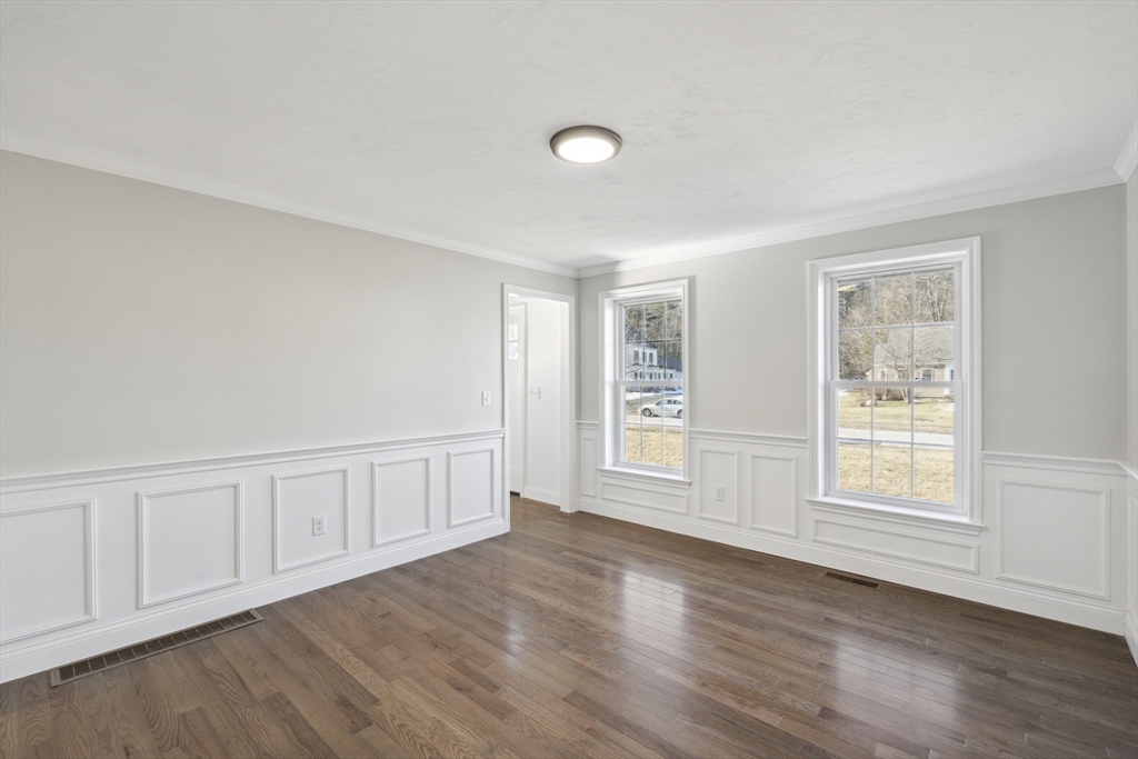 6 Coppersmith Way Townsend, MA 01469 - Photo 7 of 33 a view of an empty room with wooden floor and a window