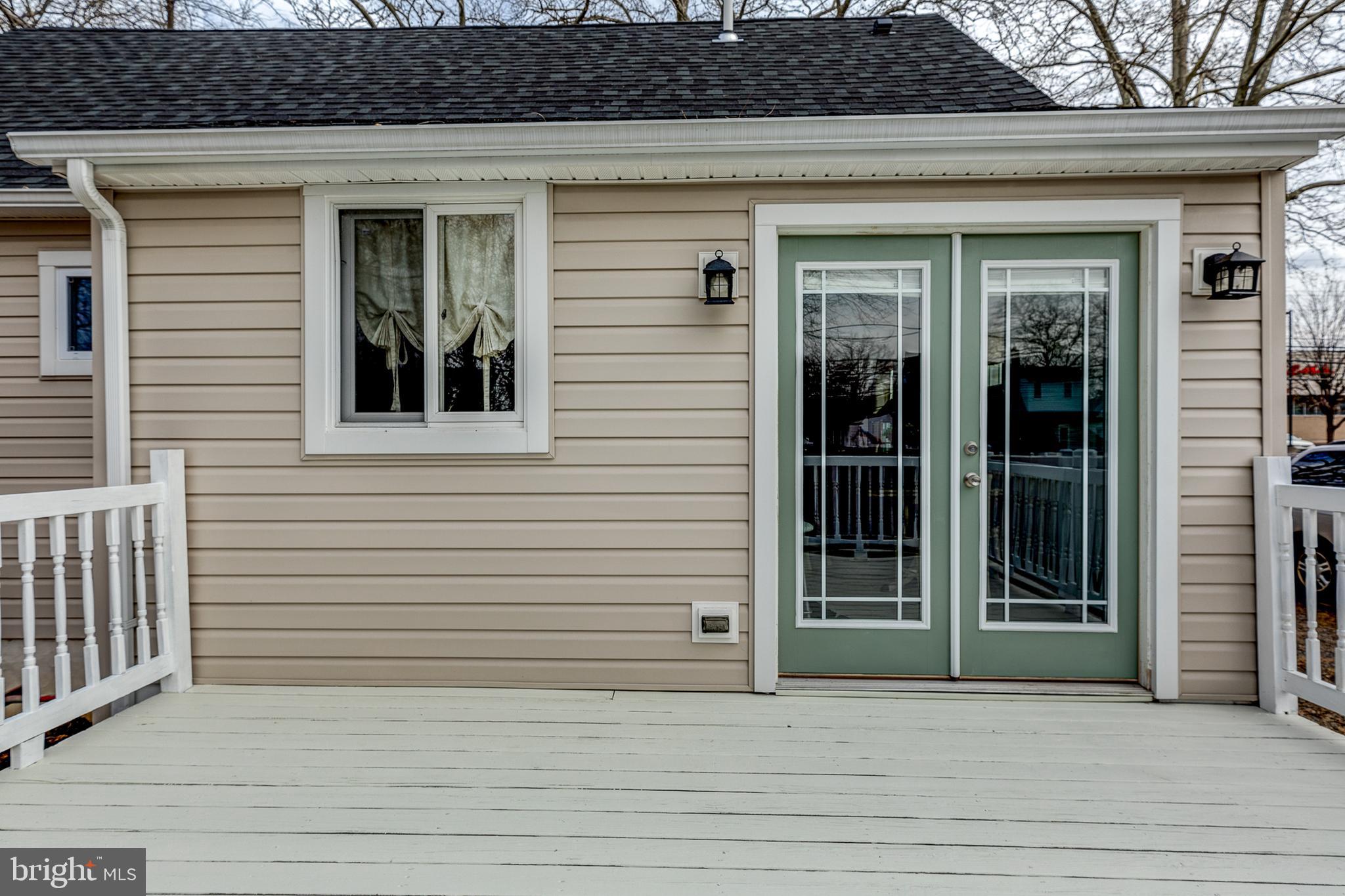 17 West County Line Road Hatboro, PA 19040 - Photo 16 of 20 Deck with Slider Doors Leading From Kitchen