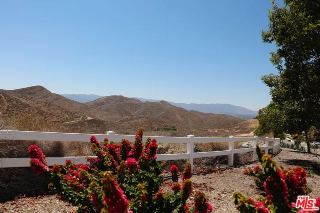 a view of a town with mountains in the background