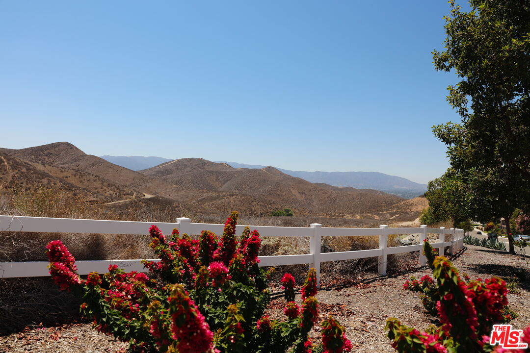 a view of a town with mountains in the background