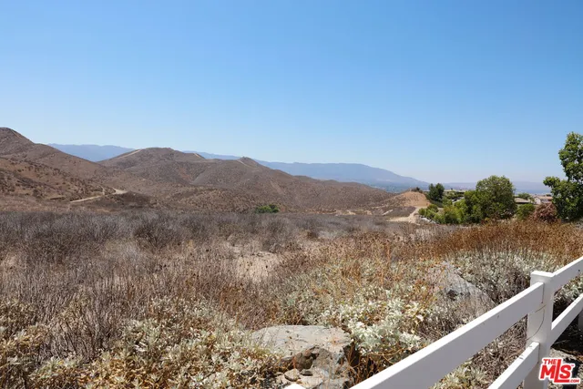 a view of a mountain from a balcony