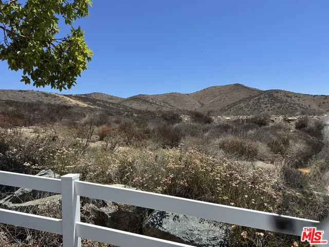 a view of a mountain from a balcony