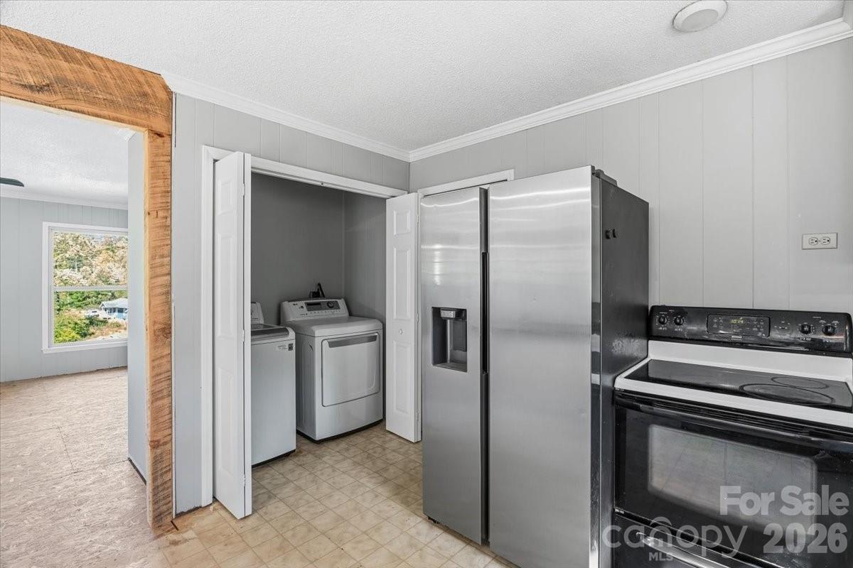 14 Jack Sullins Road Spruce Pine, NC 28777 - Photo 19 of 37 a kitchen with a refrigerator and a stove top oven