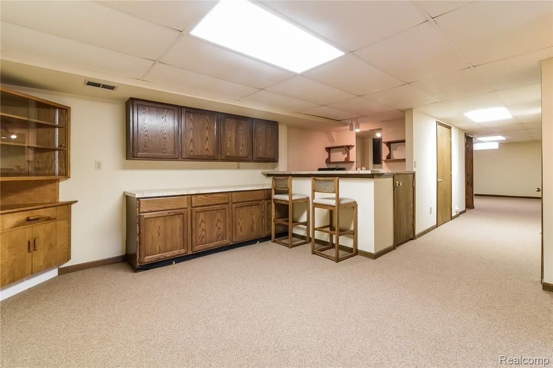 200 Mack Road Leonard, MI 48367 - Photo 21 of 42 Basement kitchenette bar.jpg